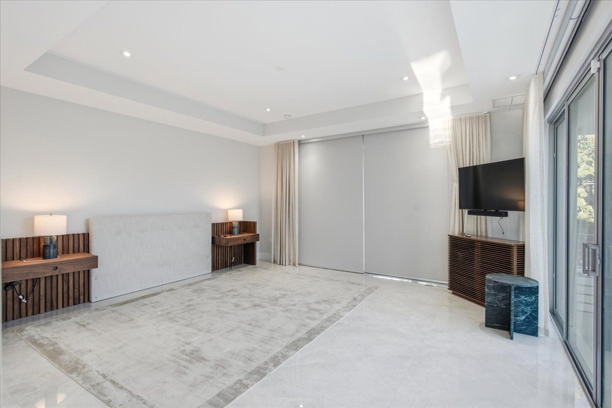 Primary suite terrace overlooking the tree canopy